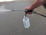 Straight Fog Gun with Cleaning bottle in use